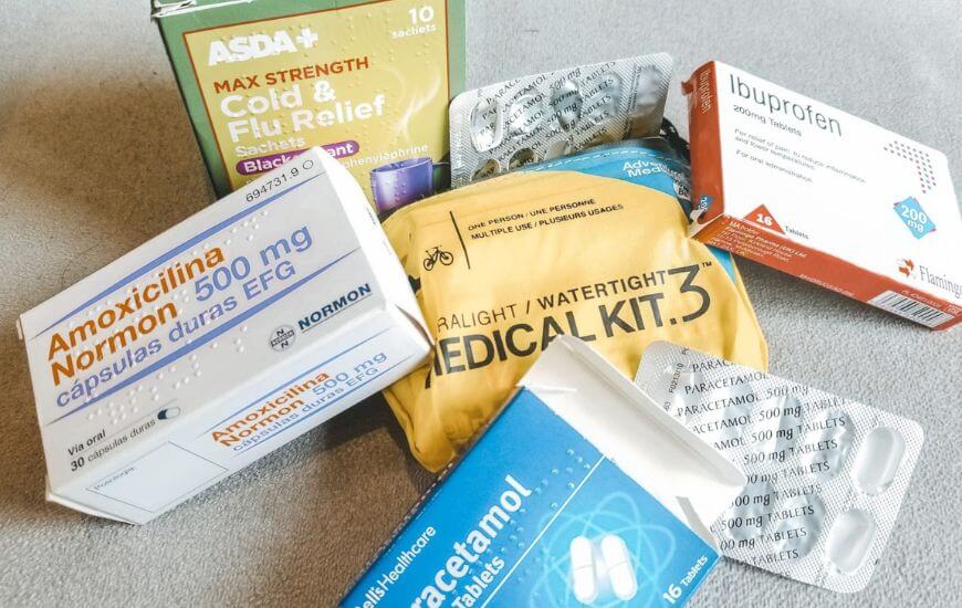 a bundle of over the counter medicines at home with my documents for a long trip