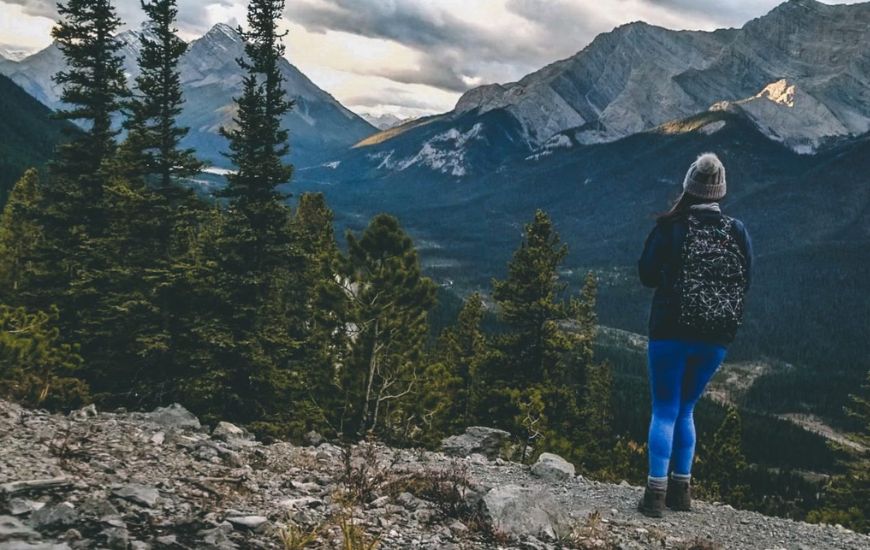 me looking at mountains with a backpack