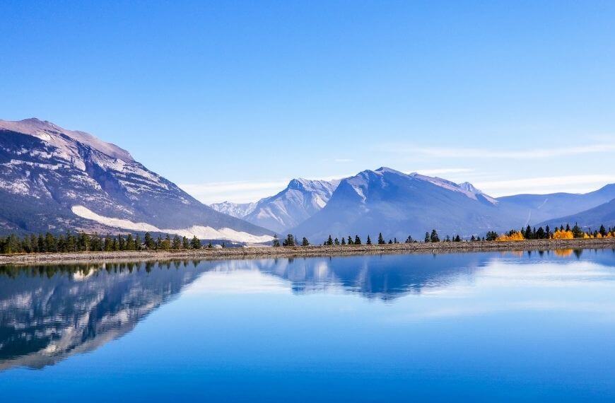this quiet still water at rundle forebay is another hiking trail you can walk to from canmore