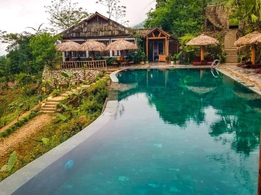 infinity pool in our eco-friendly accommodation with straw huts