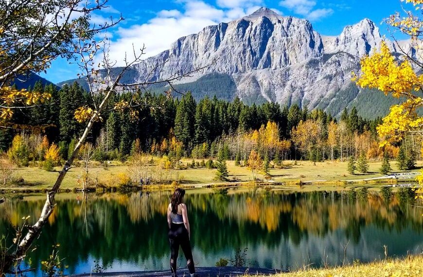 Me standing at the lake's edge at Quarry Lake in Canmore