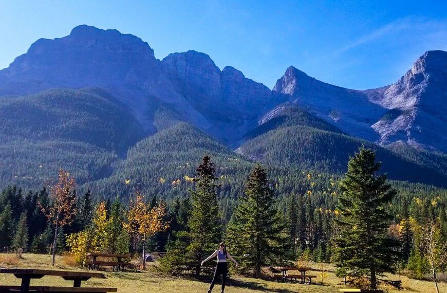 picnic benches surrounded by the Canmore mountains