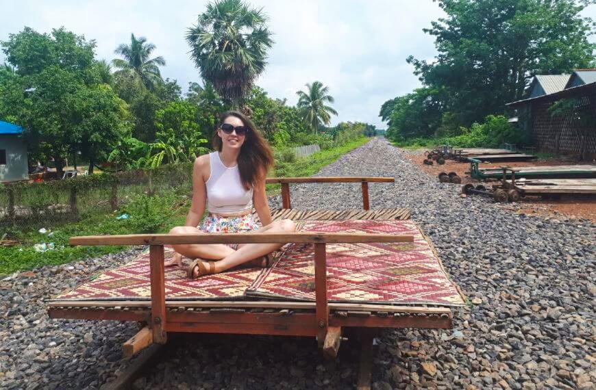 us sitting on the bamboo train in battambang
