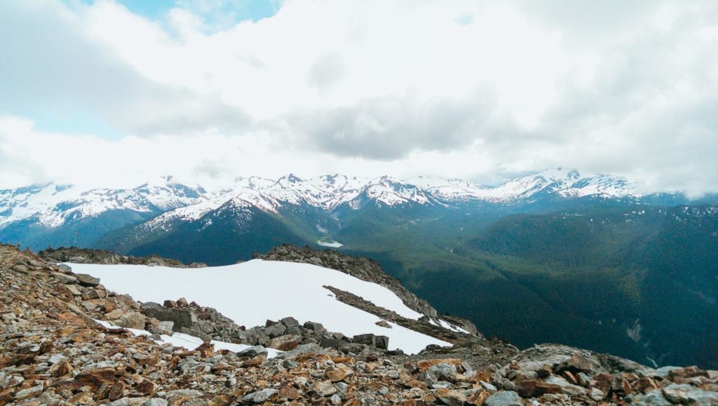 view overlooking the snowy mountains - walking trail in whistler if you don't ski