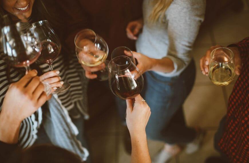 group of friends drinking wine after moving to canada from the uk