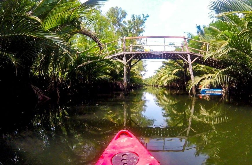 front end of kayak and a bridge in cambodia