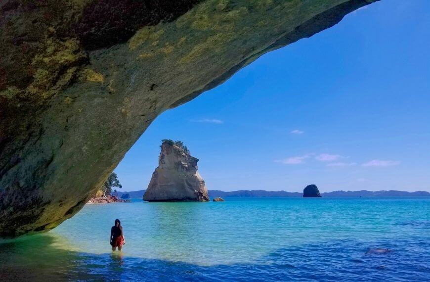 me under the rock formation in the knee deep sea tide