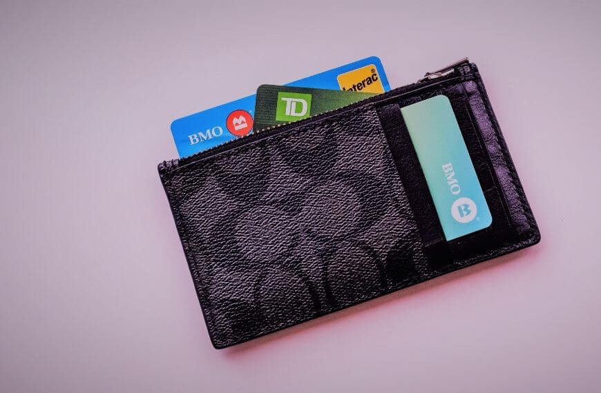 Wallet with some canada bank cards poking out some you will need when moving from the uk