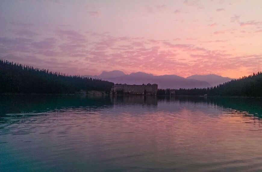 red sky during sunrise over the lake