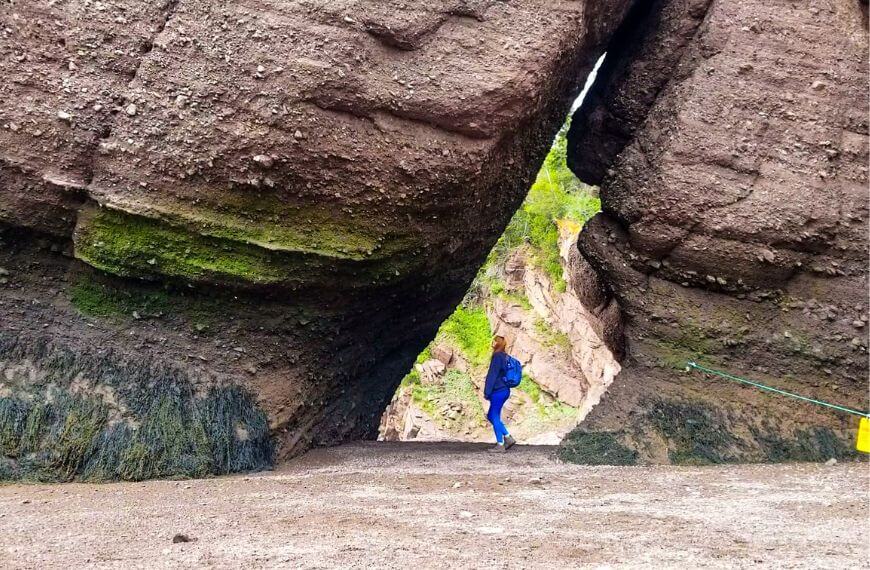 me standing in a cave created by high tides at hopewell rocks in the bay of fundy 