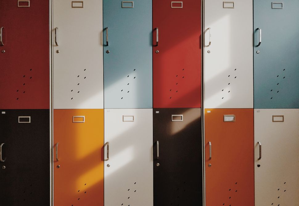 a line of coloured lockers similar to those used in a hostel - disadvantages of staying in a hostel is you need to lock your belongings away
