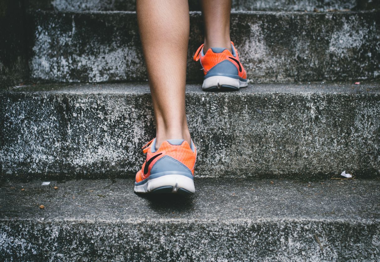 footsteps walking up concrete steps is how to stay fit while travelling