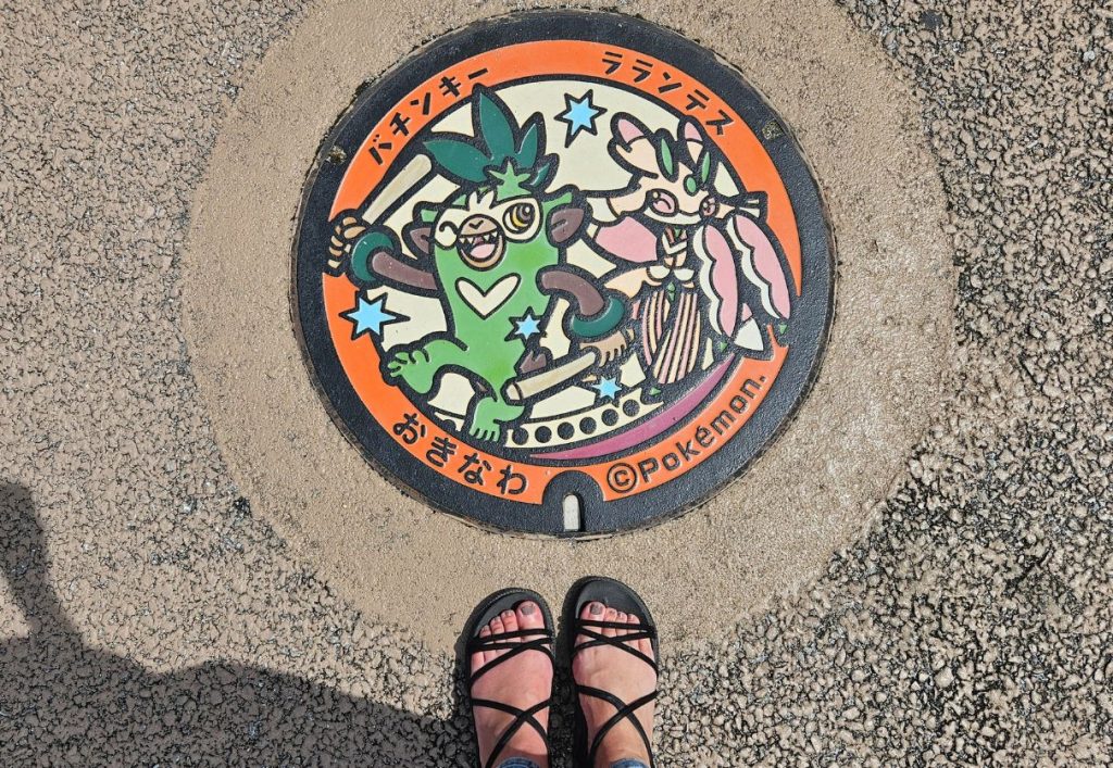Orange manhole cover with pokemon on